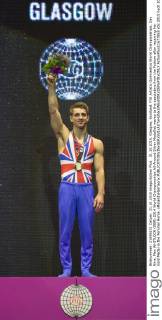 31.10.2015. Glasgow, Scotland. FIG Artistic Gymnastics World Championships. Day Nine. Max WHITLOCK (GBR) 2014 World Championships All-Around Silver Medallist waves to the spectators from the Podium after receiving his Gold Medal in the Pommel Horse. xRolandxHarrisonx  ActionPlus11677853