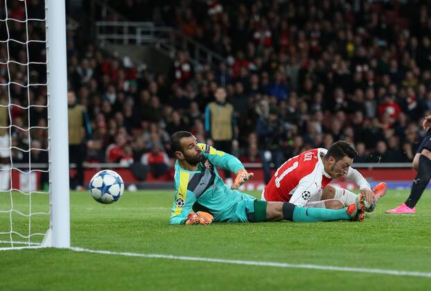 Arsenal s Mesut Ozil scoring his sides opening goal UEFA Champions League- Arsenal v Dinamo Zagreb - Emirates Stadium - England - 24th November 2015 - Picture David Klein Sportimage EDITORIAL USE ONLY. No use with unauthorised audio, video, data, fixture lists, club league logos or live services. Online in-match use limited to 120 images, no video emulation. No use in betting, games or single club league player publications.