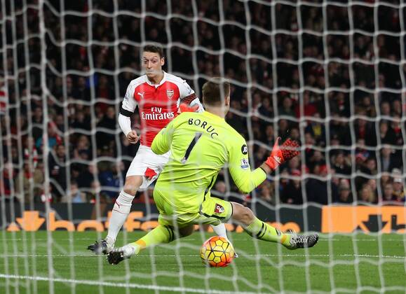 Arsenal s Mesut Ozil scoring his sides second goal Barclays Premier League- Arsenal vs AFC Bournemouth - Emirates Stadium - England - 28th December 2015 - Picture - David Klein Sportimage EDITORIAL USE ONLY. No use with unauthorised audio, video, data, fixture lists, club league logos or live services. Online in-match use limited to 120 images, no video emulation. No use in betting, games or single club league player publications.