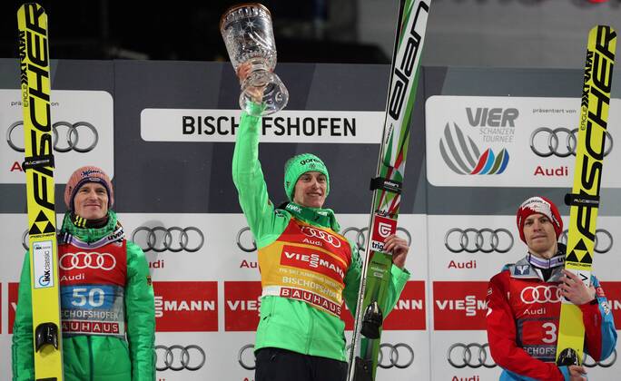 NORDIC SKIING - FIS WC Bischofshofen, Four Hills Tournament BISCHOFSHOFEN,AUSTRIA,06.JAN.16 - NORDIC SKIING, Ski jumping Skispringen Ski nordisch - FIS World Cup, Four Hills Tournament, large hill, men, award ceremony. Image shows the rejoicing of Severin Freund (GER), Peter Prevc (SLO) and Michael Hayboeck (AUT). Keywords: trophy. GEPAxpictures xThomasxBachun