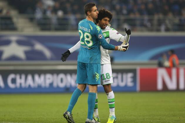 Wolfsburg s goalkeeper Koen Casteels and Wolfsburg s Dante celebrate during a game between Belgian KAA Gent and German VfL Wolfsburg, a first leg of the 1 8 finals of the UEFA Champions League competition, in Gent, Wednesday 17 February 2016. BRUNOxFAHY x04794882x