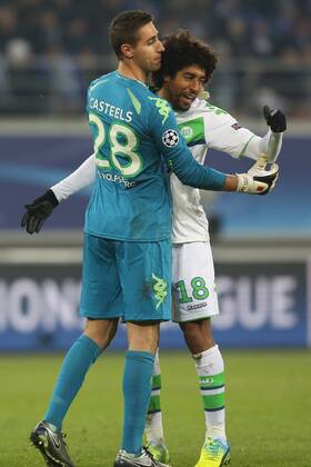 Wolfsburg s goalkeeper Koen Casteels and Wolfsburg s Dante celebrate during a game between Belgian KAA Gent and German VfL Wolfsburg, a first leg of the 1 8 finals of the UEFA Champions League competition, in Gent, Wednesday 17 February 2016. BRUNOxFAHY x04794883x
