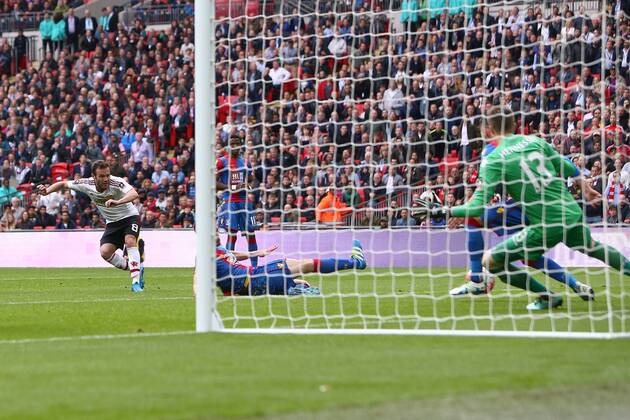 Juan Mata of Manchester United ManU scores his sides first goal during the Emirates FA Cup Final match at Wembley Stadium. Photo credit should read: Philip Oldham Sportimage EDITORIAL USE ONLY. No use with unauthorised audio, video, data, fixture lists, club league logos or live services. Online in-match use limited to 120 images, no video emulation. No use in betting, games or single club league player publications.