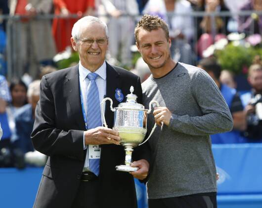 17.06.2016. Queens Club, London, England. Aegon Queens Tennis Championships Day Five. The tournament celebrated its four time champions on Centre Court this afternoon with presentations of quarter sized trophies to four-time champions Boris Becker, John McEnroe, Roy Emerson and Lleyton Hewitt. Aussies Roy Emerson and Lleyton Hewitt show off a replica trophy. xAlanxMartinx  ActionPlus11750643