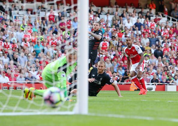 Arsenal s Theo Walcott scoring his sides opening goal during the Premier League match at the Emirates Stadium, London. Picture date August 14th, 2016 Pic David Klein Sportimage EDITORIAL USE ONLY. No use with unauthorised audio, video, data, fixture lists, club league logos or live services. Online in-match use limited to 120 images, no video emulation. No use in betting, games or single club league player publications.