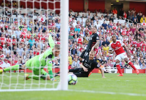Arsenal s Theo Walcott scoring his sides opening goal during the Premier League match at the Emirates Stadium, London. Picture date August 14th, 2016 Pic David Klein Sportimage EDITORIAL USE ONLY. No use with unauthorised audio, video, data, fixture lists, club league logos or live services. Online in-match use limited to 120 images, no video emulation. No use in betting, games or single club league player publications.