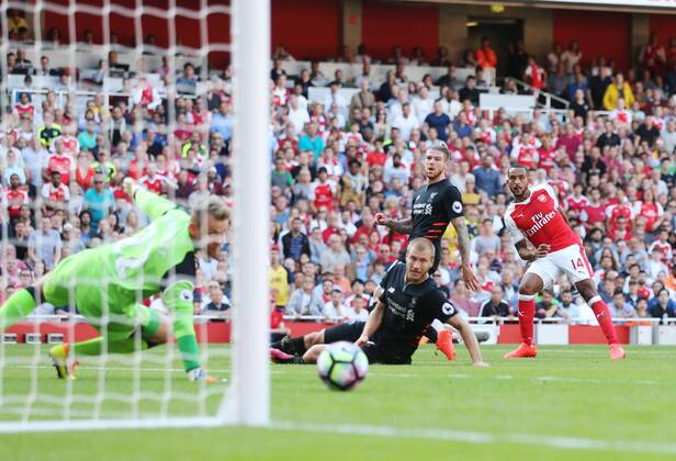 Arsenal s Theo Walcott scoring his sides opening goal during the Premier League match at the Emirates Stadium, London. Picture date August 14th, 2016 Pic David Klein Sportimage EDITORIAL USE ONLY. No use with unauthorised audio, video, data, fixture lists, club league logos or live services. Online in-match use limited to 120 images, no video emulation. No use in betting, games or single club league player publications.