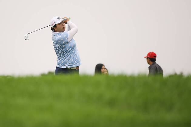 BEIJING, CHINA - SEPTEMBER 26: Feng Shanshan of China swings the club during a training session on Day one of 2016 Reignwood LPGA Golf Damen Classic at Reignwood Pine Valley on September 26, 2016 in Beijing, China. CFP492737099