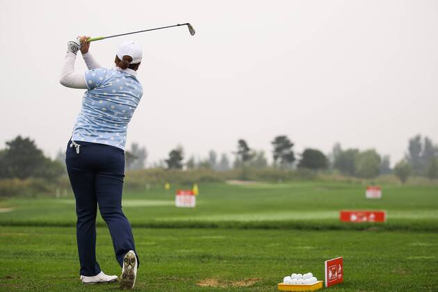 BEIJING, CHINA - SEPTEMBER 26: Feng Shanshan of China swings the club during a training session on Day one of 2016 Reignwood LPGA Golf Damen Classic at Reignwood Pine Valley on September 26, 2016 in Beijing, China. CFP492737102