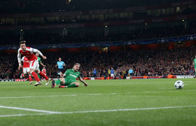 Arsenal s Mesut Ozil scoring his sides fourth goal during the Champions League group A match at the Emirates Stadium, London. Picture date October 19th, 2016 Pic David Klein Sportimage EDITORIAL USE ONLY. No use with unauthorised audio, video, data, fixture lists, club league logos or live services. Online in-match use limited to 120 images, no video emulation. No use in betting, games or single club league player publications.