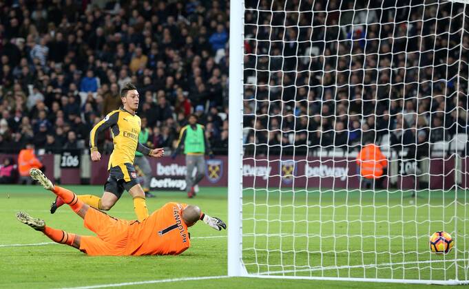 Arsenal s Mesut Ozil scoring his sides opening goal during the Premier League match at the London Stadium, London. Picture date December 3rd, 2016 Pic David Klein Sportimage EDITORIAL USE ONLY. No use with unauthorised audio, video, data, fixture lists, club league logos or live services. Online in-match use limited to 120 images, no video emulation. No use in betting, games or single club league player publications.