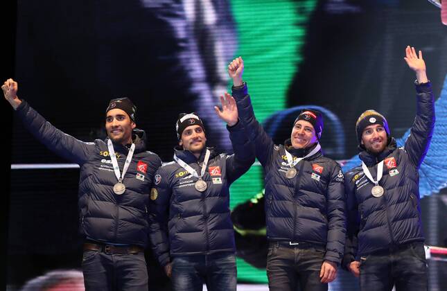 HOCHFILZEN, AUSTRIA - FEBRUARY 18, 2017: Biathletes Martin Fourcade, Simon Desthieux, Quentin Fillon Maillet, and Jean Guillaume Beatrix, from left, of France pose with their silver medals at a victory ceremony for the men s 4x7.5km relay at the 2017 IBU Biathlon World Championships in Hochfilzen, Austria. Stanislav Krasilnikov TASS  TS041D1F