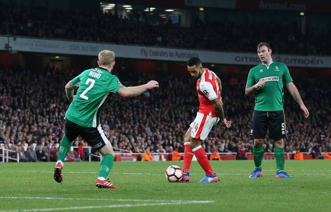 Arsenal s Theo Walcott scoring his sides opening goal during the FA Cup Quarter Final match at the Emirates Stadium, London. Picture date March 11th, 2017 Pic David Klein Sportimage EDITORIAL USE ONLY. No use with unauthorised audio, video, data, fixture lists, club league logos or live services. Online in-match use limited to 120 images, no video emulation. No use in betting, games or single club league player publications.