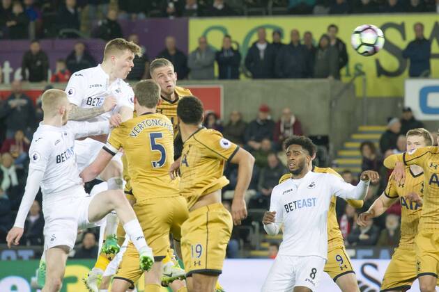 Football - 2016 2017 Premier League - Swansea City vs. Tottenham Hotspur Olie McBurnie of Swansea heads at goal in the final minutes of the match , at The Liberty Stadium. COLORSPORT WINSTON BYNORTH
