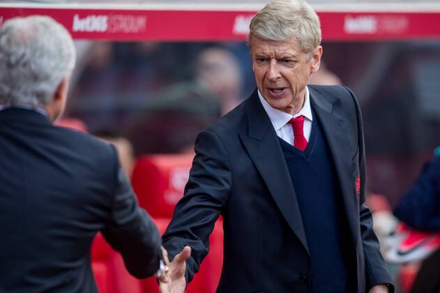 Arsene Wenger manager of Arsenal shakes hands with Mark Hughes manager of Stoke City before the Premier League match between Stoke City and Arsenal at the Bet365 Stadium, Stoke-on-Trent, England on 13 May 2017. Copyright: xMatthewxBuchanx 15340014