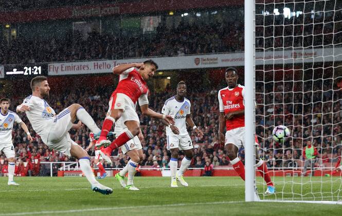 Arsenal s Alexis Sanchez scoring his sides second goal during the Premier League match at the Emirates Stadium, London. Picture date: May 16th, 2017. Pic credit should read: David Klein Sportimage EDITORIAL USE ONLY. No use with unauthorised audio, video, data, fixture lists, club league logos or live services. Online in-match use limited to 120 images, no video emulation. No use in betting, games or single club league player publications.