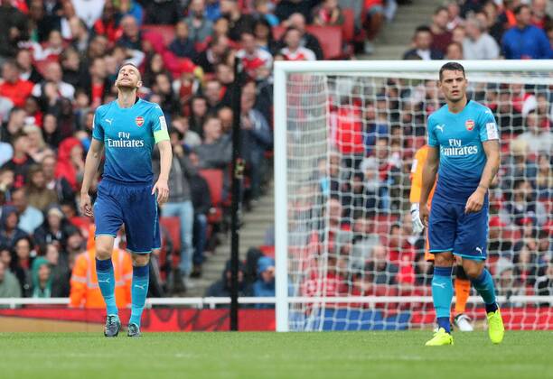 Arsenal s Per Mertesacker looks on dejected after Benfica s opening goal during the pre season match at the Emirates Stadium, London. Picture date 29th July 2017. Picture credit should read: David Klein Sportimage EDITORIAL USE ONLY. No use with unauthorised audio, video, data, fixture lists, club league logos or live services. Online in-match use limited to 120 images, no video emulation. No use in betting, games or single club league player publications.