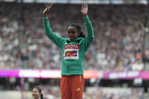 Athletics - 2017 IAAF London World Athletics Championships - Day Three, Evening Session Womens 10000m Medal Ceremony Almaz Ayana (Ethiopia) steps onto the gold medal podium and takes the applause of the crowd at the London Stadium COLORSPORT DANIEL BEARHAM  csp_WrlAth_d3PM