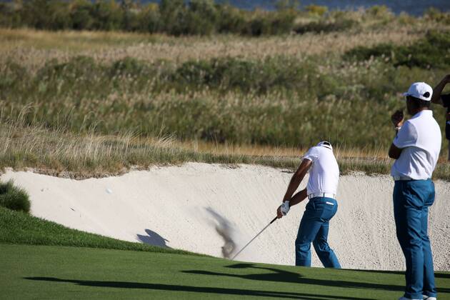 JERSEY CITY, NJ - SEPTEMBER 28: International golfer Hideki Matsuyama watches playing partner Charl Schwartzel hit out of a bunker on the 14th hole during the first round of the Presidents Cup on September 28, 2017, at Liberty National Golf Club in Jersey City, NJ. (Photo by Brian Spurlock Icon Sportswire) GOLF: SEP 28 PGA Golf Herren - The Presidents Cup - First Round Icon17092861 EDITORIAL USE ONLY