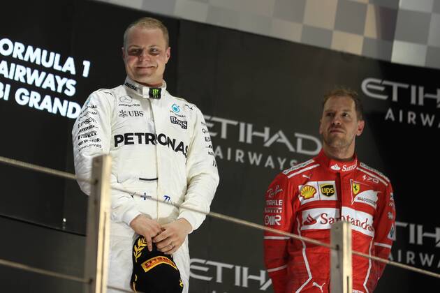 26th November 2017, Yas Marina Circuit, Abu Dhabi, UAE; Abu Dhabi Formula One Grand Prix, Sunday race day; Valtteri Bottas - Mercedes AMG Petronas F1 Team wins the race talks with Sebastian Vettel - Scuderia Ferrari  ActionPlus11956621