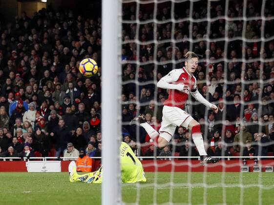 Arsenal s Mesut Ozil scoring his sides fourth goal during the premier league match at the Emirates Stadium, London. Picture date 29th November 2017. Picture credit should read: David Klein Sportimage EDITORIAL USE ONLY. No use with unauthorised audio, video, data, fixture lists, club league logos or live services. Online in-match use limited to 120 images, no video emulation. No use in betting, games or single club league player publications.