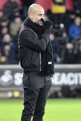 Football - 2017 2018 Premier League - Swansea City vs. Manchester City Manchester City manager Pep Guardiola on the touchline at The Liberty Stadium. COLORSPORT WINSTON BYNORTH