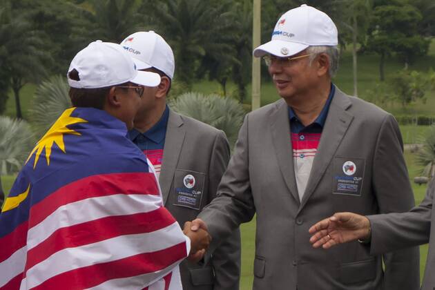 January 14, 2018 - Kuala Lumpur, Kuala Lumpur, Malaysia - Nicholas Fung is seen shake hand with Malaysia Prime Minister Najib Razak at the last day of Eurasia Cup...EurAsia Cup is a biennial men professional team golf tournament between Europe and Asia presented by DRB-HICOM. It is held on 12th 14th January 2018 at Glenmarie Golf & Country Club. Team Asia will be lead by Arjun Atwal (India) as a captain for the team and the vice captain Zhang Lainwei (China) while for the team Europe Thomas Bjorn (Denmark) will be the captain. The Team Europe has win the EurAsia Cup for this year. Malaysia: EurAsia golf tournament Winning ceremony - ZUMAs197 81558914st Copyright: xFarisxHadziqx xSopaxImagesx