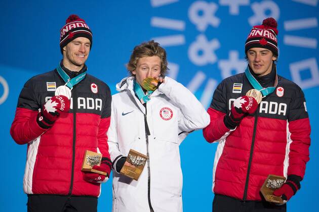 From left menÕs snowboard slopestyle silver medalist Max Parrot of Canada, gold medalist Redmond Gerard of the United States and bronze medalist Mark McMorris of Canada pose for a photo on the podium during a medal ceremony for the Pyeongchang 2018 Winter Olympics, at the Olympic Medal Plaza in Daegwalnyeong, South Korea, on February 11, 2018.  OLY20180211147 MATTHEWxHEALEY