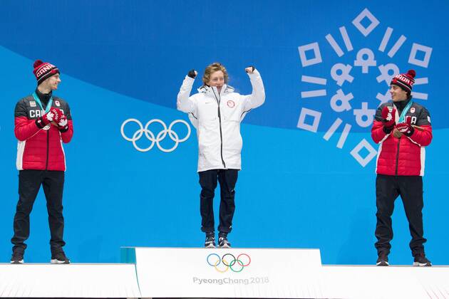 From left menÕs snowboard slopestyle silver medalist Max Parrot of Canada, gold medalist Redmond Gerard of the United States and bronze medalist Mark McMorris of Canada celebrate on the podium during a medal ceremony for the Pyeongchang 2018 Winter Olympics, at the Olympic Medal Plaza in Daegwalnyeong, South Korea, on February 11, 2018.  OLY20180211141 MATTHEWxHEALEY