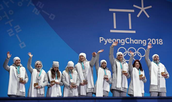PYEONGCHANG, SOUTH KOREA – FEBRUARY 12, 2018: Olympic Athletes from Russia Mikhail Kolyada, Evgenia Medvedeva, Alina Zagitova, Yevgenia Tarasova, Vladimir Morozov, Natalya Zabiyako, Alexander Enbert, Ekaterina Bobrova, and Dmitri Soloviev (L-R) pose with their silver medals during the victory ceremony for the Figure skating Eiskunstlauf team event at the 2018 Winter Olympic Games Olympische Spiele Olympia OS Valery Sharifulin TASS TS0737CA