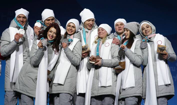 PYEONGCHANG, SOUTH KOREA – FEBRUARY 12, 2018: Olympic Athletes from Russia Dmitri Soloviev, Alexander Enbert, Ekaterina Bobrova, Natalya Zabiyako, Vladimir Morozov, Yevgenia Tarasova, Mikhail Kolyada, Alina Zagitova, and Evgenia Medvedeva, from left, pose with their silver medals during the victory ceremony for the Figure skating Eiskunstlauf team event at the 2018 Winter Olympic Games Olympische Spiele Olympia OS Valery Sharifulin TASS TS0737CC