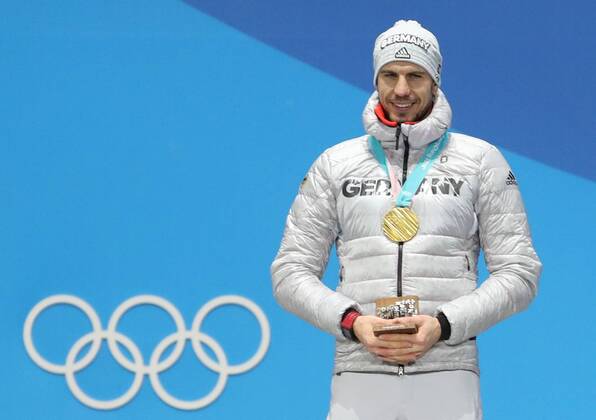 (180213) -- PYEONGCHANG, Feb. 13, 2018 -- Champion Arnd Peiffer from Germany poses for photos during the medal ceremony of men s 10km sprint event of biathlon at 2018 PyeongChang Winter Olympic Games Olympische Spiele Olympia OS at the Medal Plaza in PyeongChang, South Korea, on Feb. 13, 2018. ) (SP)OLY-SOUTH KOREA-PYEONGCHANG-BIATHLON-MEN S 10KM SPRINT-MEDAL CEREMONY BaixXuefei 