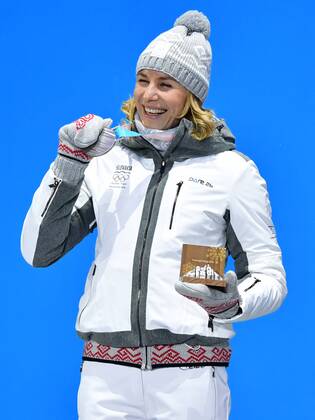 Silver medalist Slovakia s Anastasiya Kuzmina, celebrates during the medal ceremony for Biathlon Women s 10km Pursuit at the medal s plaza during the Pyeongchang 2018 Winter Olympics in Pyeongchang, South Korea, on February 13, 2018.  OLY20180213376 KEVINxDIETSCH