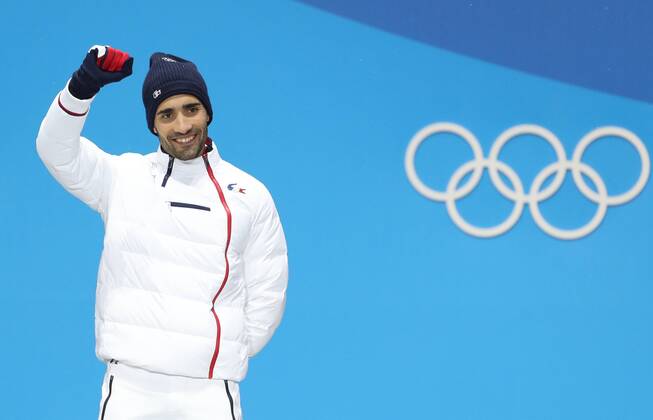 (180213) -- PYEONGCHANG, Feb. 13, 2018 -- Champion Martin Fourcade from France poses for photos during medal ceremony of men s 12.5km pursuit event of biathlon at 2018 PyeongChang Winter Olympic Games Olympische Spiele Olympia OS at the Medal Plaza in PyeongChang, Feb. 13, 2018. ) (SP)OLY-SOUTH KOREA-PYEONGCHANG-BIATHLON-MEN S 12.5KM PERSUIT-MEDAL CEREMONY BaixXuefei 
