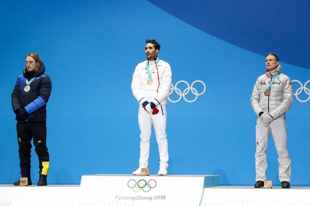 OLYMPICS - 2018 Winter Olympics PYEONGCHANG,SOUTH KOREA.13.FEB.18 - OLYMPICS,BIATHLON - Olympic Winter games Winterspiele Spiele Summer games PyeongChang 2018, Medals Plaza, 12.5km Pursuit, men, award ceremony. Image shows Sebastian Samuelsson (SWE), Martin Fourcade (FRA) and Benedikt Doll (GER). Keywords: medals. GEPAxpictures xMaticxKlansek