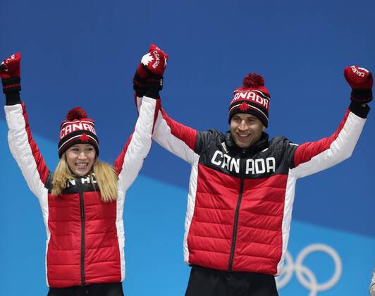 (180214) -- PYEONGCHANG, Feb. 14, 2018 -- Champion Kaitlyn Lawes (L) and John Morris of Canada celebrate during medal ceremony of the mixed doubles event of curling at 2018 PyeongChang Winter Olympic Games Olympische Spiele Olympia OS at the Medal Plaza in PyeongChang, South Korea, on Feb. 14, 2018. ) (SP)OLY-SOUTH KOREA-PYEONGCHANG-CURLING-MIXED DOULBES-MEDAL CEREMONY WuxZhuang 