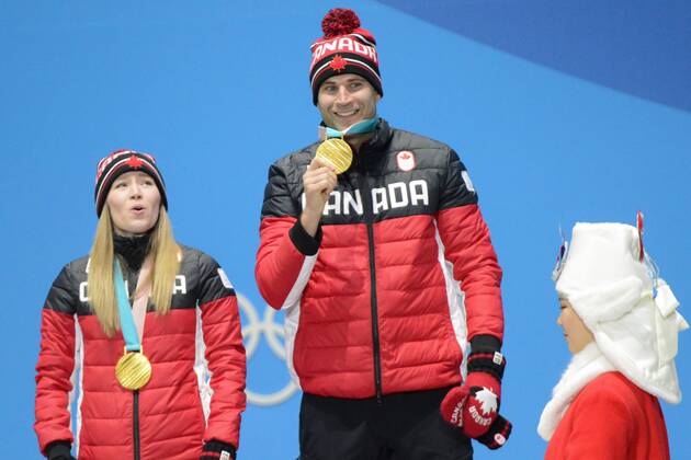 February 14, 2018 - Pyeongchang, South Korea - KAITLYN LAWES and JOHN MORRIS of Canada celebrate getting the gold medal in the Mixed Doubles curling event in the PyeongChang Olympic Games Olympische Spiele Olympia OS PyeongChang 18: Curling Mixed Doubles - ZUMAl132 20180214_zap_l132_105 Copyright: xChristopherxLevyx