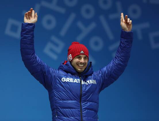 PYEONGCHANG, SOUTH KOREA - FEBRUARY 16, 2018: Bronze medalist, Great Britain s Dominic Dom Parsons celebrates during a victory ceremony for the men s skeleton event at the 2018 Winter Olympic Games Olympische Spiele Olympia OS at Medal Plaza. Valery Sharifulin TASS  TS074333