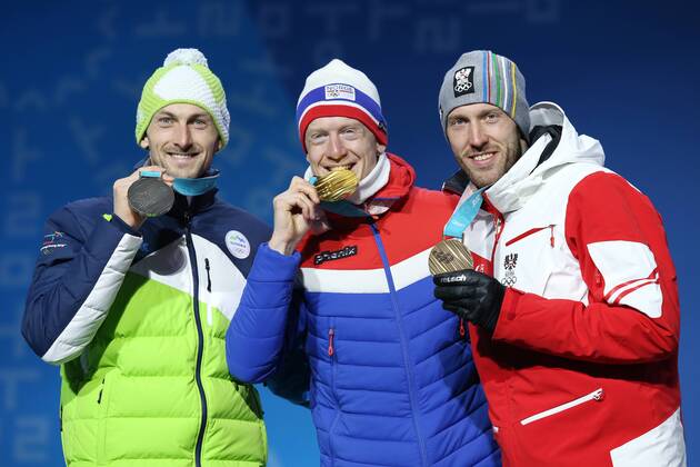 OLYMPICS - 2018 Winter Olympics PYEONGCHANG,SOUTH KOREA,16.FEB.18 - OLYMPICS,BIATHLON - Olympic Winter games Winterspiele Spiele Summer games PyeongChang 2018, Medals Plaza, 20km biathlon, men, award ceremony. Image shows Jakov Fak (SLO), Johannes Thingnes Boe (NOR) and Dominik Landertinger (AUT). GEPAxpictures xMathiasxMandl