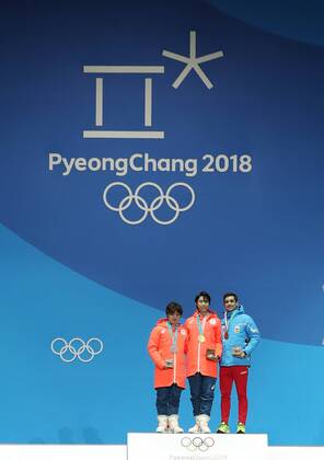 (180217) -- PYEONGCHANG, Feb. 17, 2018 -- Gold medalist Yuzuru Hanyu of Japan (C), silver medalist Shoma Uno of Japan (L) and bronze medalist Javier Fernandez of Spain pose for photos during medal ceremony of men s single skating of Figure skating Eiskunstlauf at the 2018 PyeongChang Winter Olympic Games Olympische Spiele Olympia OS at the Medal Plaza in PyeongChang, South Korea, on Feb. 17, 2018. ) (SP)OLY-SOUTH KOREA-PYEONGCHANG-FIGURE SKATING-MEN S SINGLE SKATING-MEDAL CEREMONY WuxZhuang 