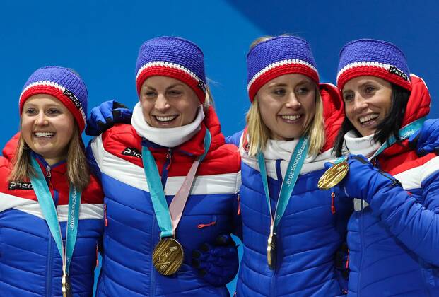 PYEONGCHANG, SOUTH KOREA - FEBRUARY 18, 2018: Gold medalists Ingvild Flugstad Oestberg, Astrid Uhrenholdt Jacobsen, Ragnhild Haga, and Marit Bjoergen (L-R) of Norway pose at a victory ceremony for the ladies cross-country skiing 4x5km relay race at the 2018 Winter Olympic Games Olympische Spiele Olympia OS at the Alpensia Cross-Country Skiing Centre. Valery Sharifulin TASS  TS0747C4