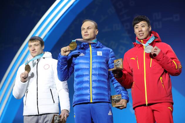 PYEONGCHANG, SOUTH KOREA â€“ FEBRUARY 19, 2018: Bronze medallist Ilya Burov, Olympic Athlete from Russia, gold medallist Oleksandr Abramenko of Ukraine, and silver medallist Jia Zongyang of China, from left, pose at a victory ceremony for the men s freestyle skiing aerials at the 2018 Winter Olympic Games Olympische Spiele Olympia OS Sergei Bobylev TASS  TS074A5F
