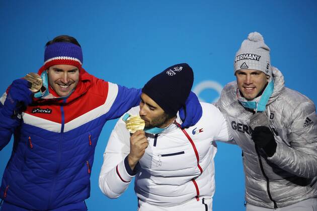 OLYMPICS - 2018 Winter Olympics PYEONGCHANG,SOUTH KOREA,19.FEB.18 - OLYMPICS, BIATHLON - Olympic Winter games Winterspiele Spiele Summer games PyeongChang 2018, Medals Plaza, 15km Mass Start, men, award ceremony. Image shows Emil Hegle Svendsen (NOR), Martin Fourcade (FRA) and Simon Schempp (GER). Keywords: medal. GEPAxpictures xAndreasxPranter