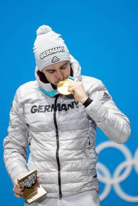 OLYMPICS - 2018 Winter Olympics PYEONGCHANG,SOUTH KOREA,21.FEB.18 - OLYMPICS,NORDIC SKIING, NORDIC COMBINED - Olympic Winter games Winterspiele Spiele Summer games PyeongChang 2018, Medals Plaza, individual large hill, men, award ceremony. Image shows the rejoicing of Johannes Rydzek (GER). Keywords: medal. GEPAxpictures xMaticxKlansek