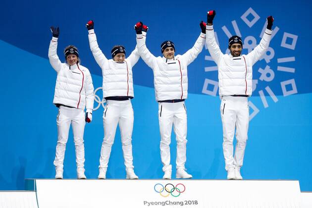 OLYMPICS - 2018 Winter Olympics PYEONGCHANG,SOUTH KOREA,21.FEB.18 - OLYMPICS,BIATHLON - Olympic Winter games Winterspiele Spiele Summer games PyeongChang 2018, Medals Plaza, 2 x 6km and 2 x 7,5km, mixed relay, award ceremony. Image shows the rejoicing of Marie Dorin Habert, Anais Bescond, Simon Desthieux and Martin Fourcade (FRA). GEPAxpictures xMaticxKlansek