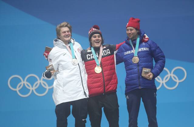 (180224) -- PYEONGCHANG, Feb. 24, 2018 -- Gold medalist Sebastien Toutant of Canada (C), silver medalist Kyle Mack of the United States (L) and bronze medalist Billy Morgan of Britain react during medal ceremony of men s big air of snowboard at the 2018 PyeongChang Winter Olympic Games Olympische Spiele Olympia OS at Medal Plaza, PyeongChang, South Korea, Feb. 24, 2018. ) (SP)OLY-SOUTH KOREA-PYEONGCHANG-SNOWBOARD-MEN S BIG AIR-MEDAL CEREMONY LixGang 