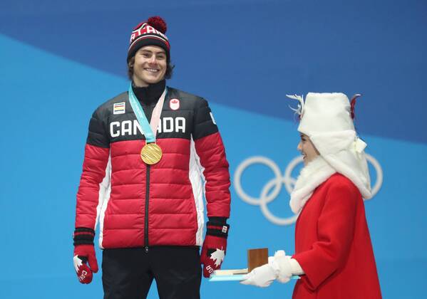 (180224) -- PYEONGCHANG, Feb. 24, 2018 -- Gold medalist Sebastien Toutant (L) of Canada poses for photos during medal ceremony of men s big air of snowboard at the 2018 PyeongChang Winter Olympic Games Olympische Spiele Olympia OS at Medal Plaza, PyeongChang, South Korea, Feb. 24, 2018. ) (SP)OLY-SOUTH KOREA-PYEONGCHANG-SNOWBOARD-MEN S BIG AIR-MEDAL CEREMONY LixGang 