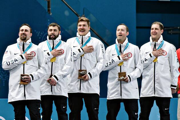 The United States Men s curling team stands for the national anthem during the medal ceremony for Men s Curling at the Pyeongchang 2018 Winter Olympics, in the Gangneung Curling Centre in Gangneung, South Korea, on February 24, 2018. The USA won the gold medal for the first time beating Sweden who took the silver.  OLY20180224501 RICHARDxELLIS