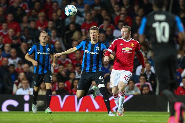 - MANCHESTER, UNITED KINGDOM: Club s Brandon Mechele and Manchester s Wayne Rooney fight for the ball during a soccer game between British club Manchester United ManU FC and Belgian team Club Brugge KV in Manchester, United Kingdom, Tuesday 18 August 2015, the first leg of the play-offs for the UEFA Champions League competition. BRUNOxFAHY x84380753x