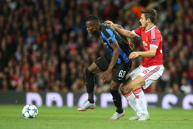 - MANCHESTER, UNITED KINGDOM: Club s Boli Bolingoli Mbombo and Manchester s Matteo Darmian fight for the ball during a soccer game between British club Manchester United ManU FC and Belgian team Club Brugge KV in Manchester, United Kingdom, Tuesday 18 August 2015, the first leg of the play-offs for the UEFA Champions League competition. BRUNOxFAHY x84381022x